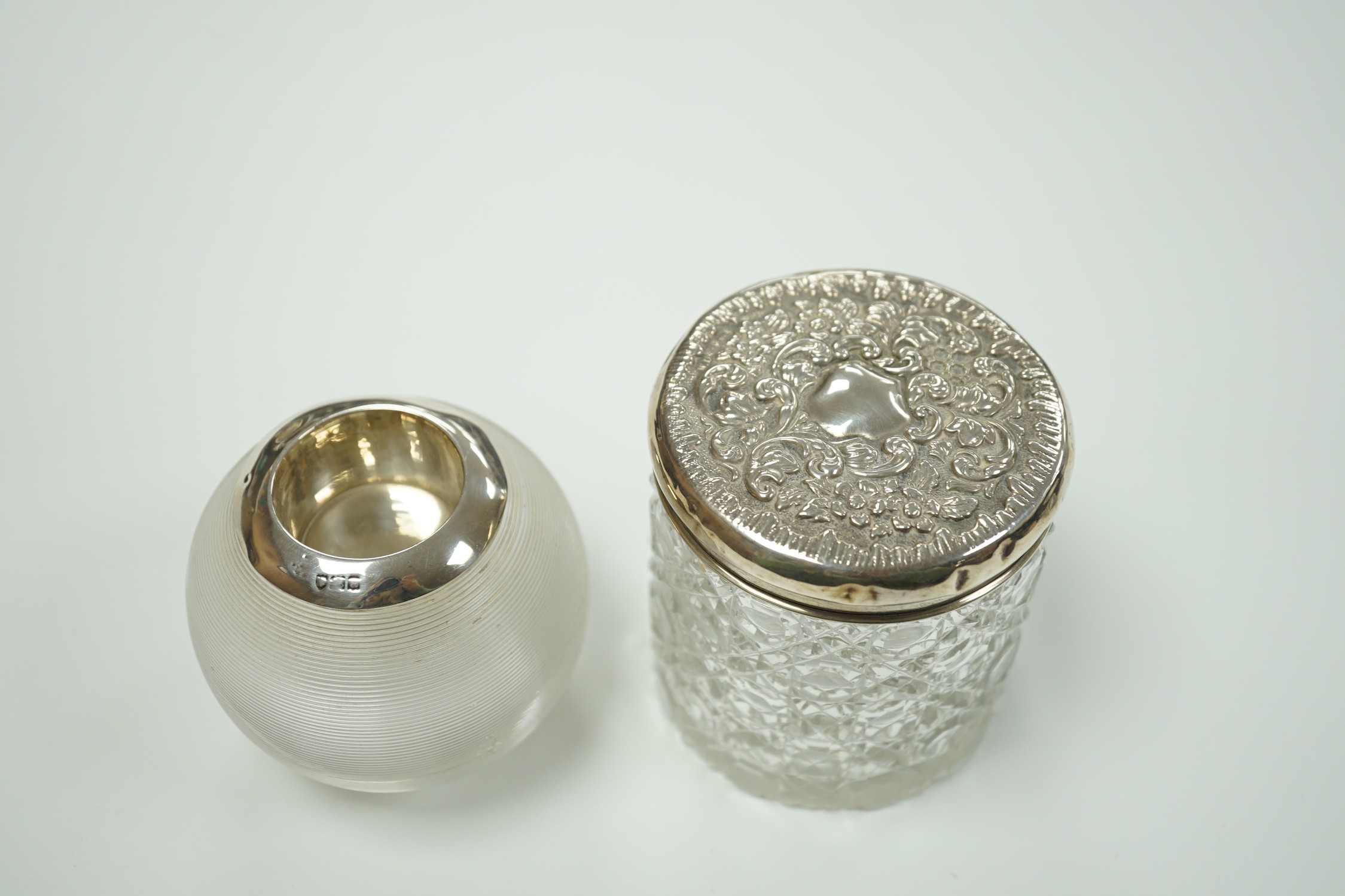 An early 20th century silver mounted ribbed glass match tidy, marks rubbed, height 70mm and a toilet jar